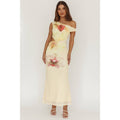 Woman wearing a floral off-shoulder dress on a white background