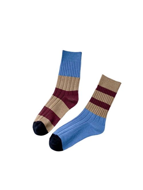 Pair of striped socks with blue, beige, and maroon colors on a white background