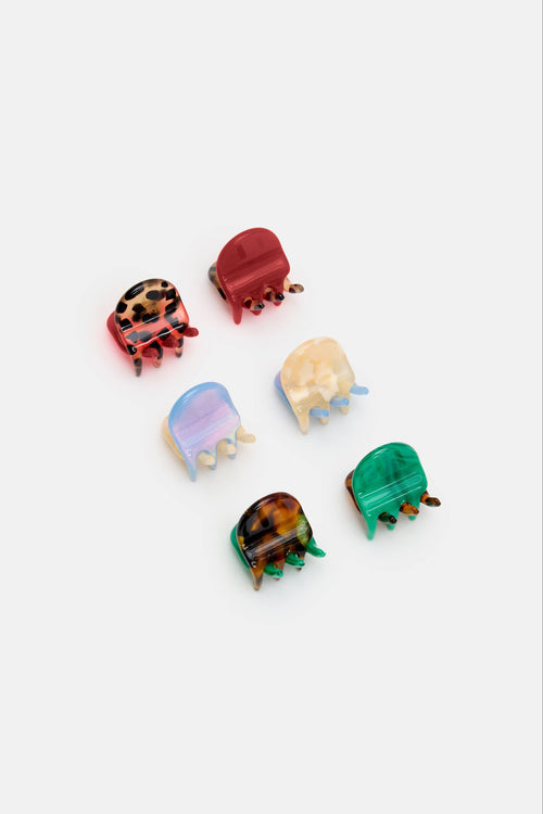 Set of colorful turtle figurines on a white background