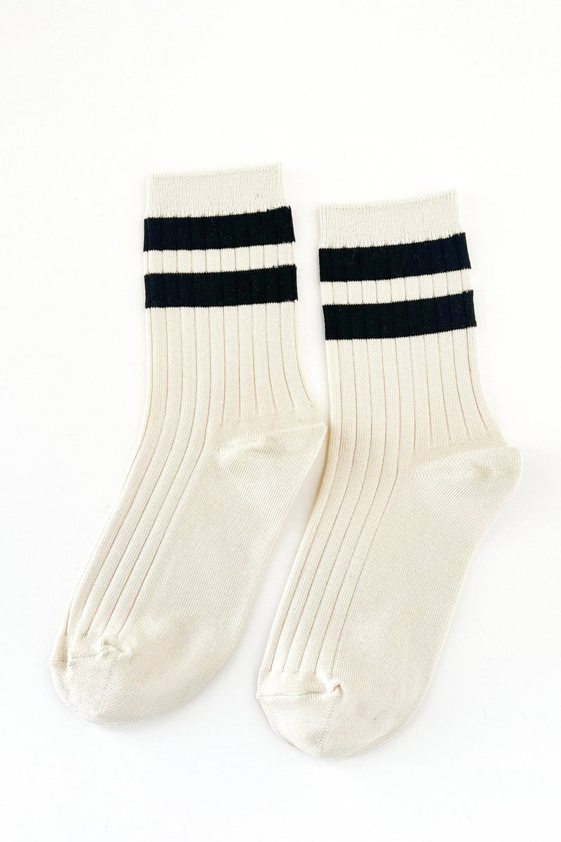 White socks with black stripes on a white background