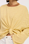 Yellow striped sweater with a knot detail worn by a person on a white background