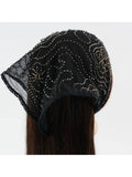 Black beaded headscarf worn by a person on a white background