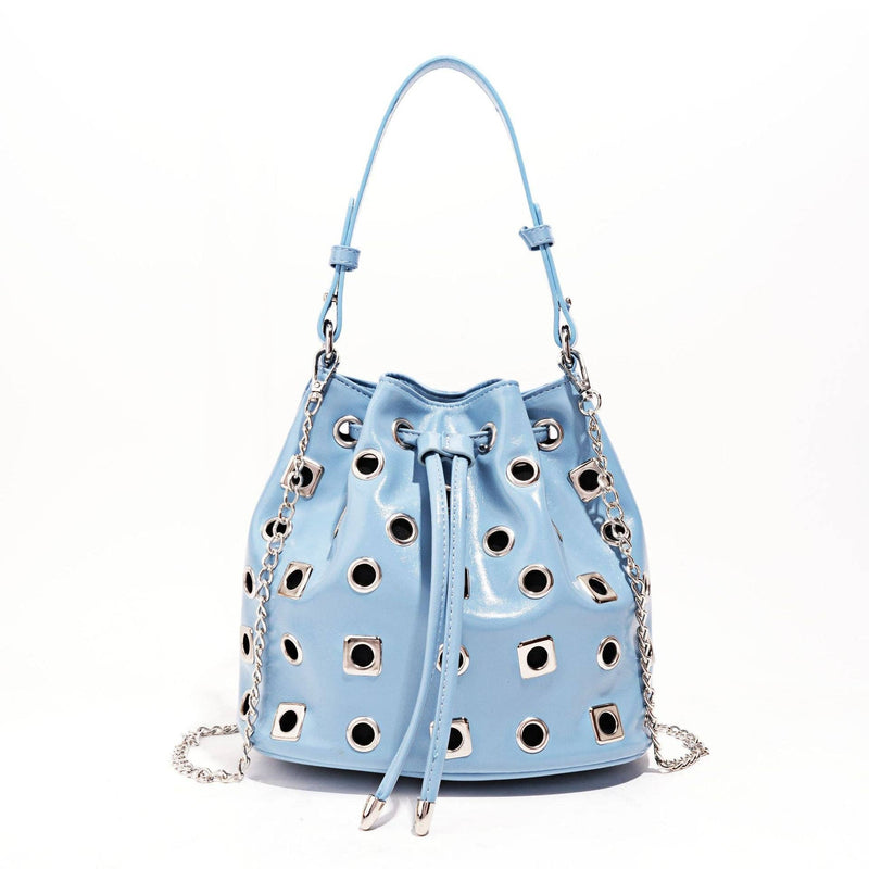 Light blue handbag with cut-out design and chain details on a white background