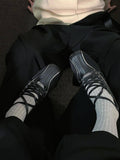 Black shoes with white detailing 