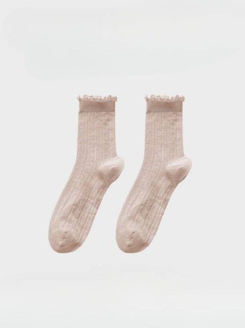 Pair of pink socks on a white background