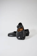 Pair of black shoes on a white background