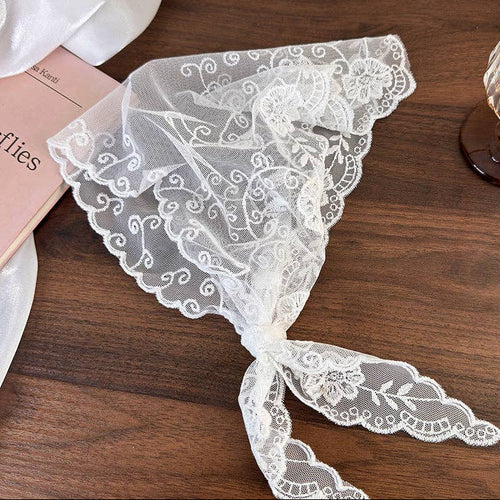White lace fabric on a wooden surface