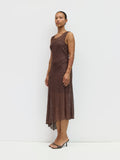 Woman wearing a brown dress against a white background