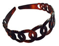 Brown tortoiseshell headband on a white background