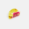 Colorful tie-dye hair clip on a white background