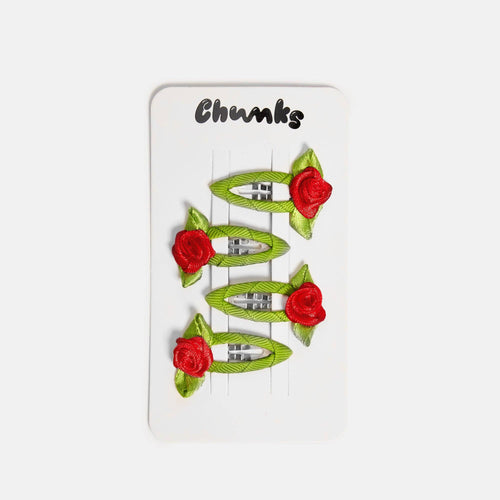 Set of green hair clips with red floral designs on a white background, branded 'Chunks'.