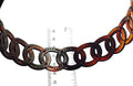 Rustic horse shoe chain with a ruler for scale on a white background