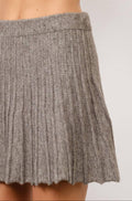 Gray knit skirt on a plain background