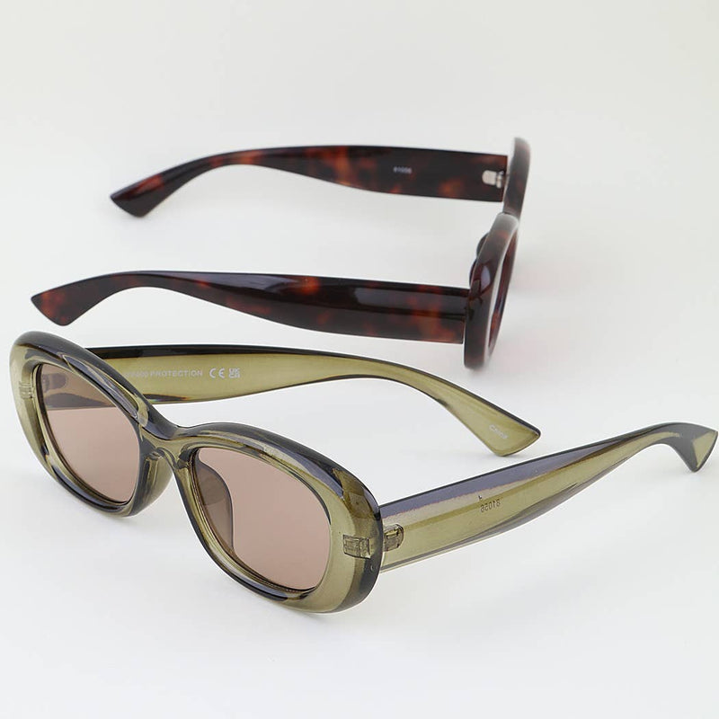 Two pairs of sunglasses with tortoiseshell and green frames on a white background