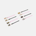 Set of hair sticks with pink ribbons on a white background