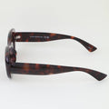 Sunglasses with tortoiseshell frame on a white background