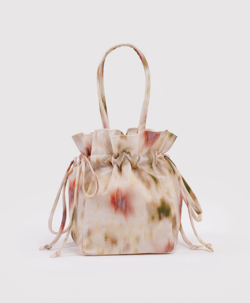 Floral patterned drawstring bag on a white background