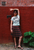 woman wearing blue philly tee and plaid skirt