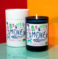 Candle and packaging with 'SMOKE' branding on a colorful background