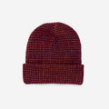 Woven patterned beanie on a light gray background