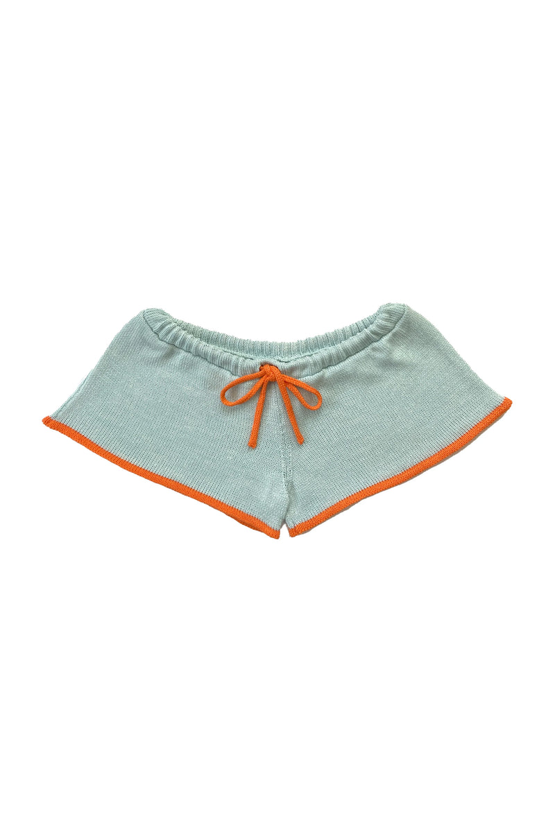 Light blue shorts with orange trim on a white background