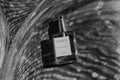 Perfume bottle labeled 'Gualtiero' on a textured surface