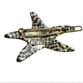 Star-shaped hair clip with checkered pattern and gold accents on a white background, branded 'French Annie'.