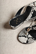 Aurora Snake-Embossed Leather Wedge Thong Sandals cropped view on white background