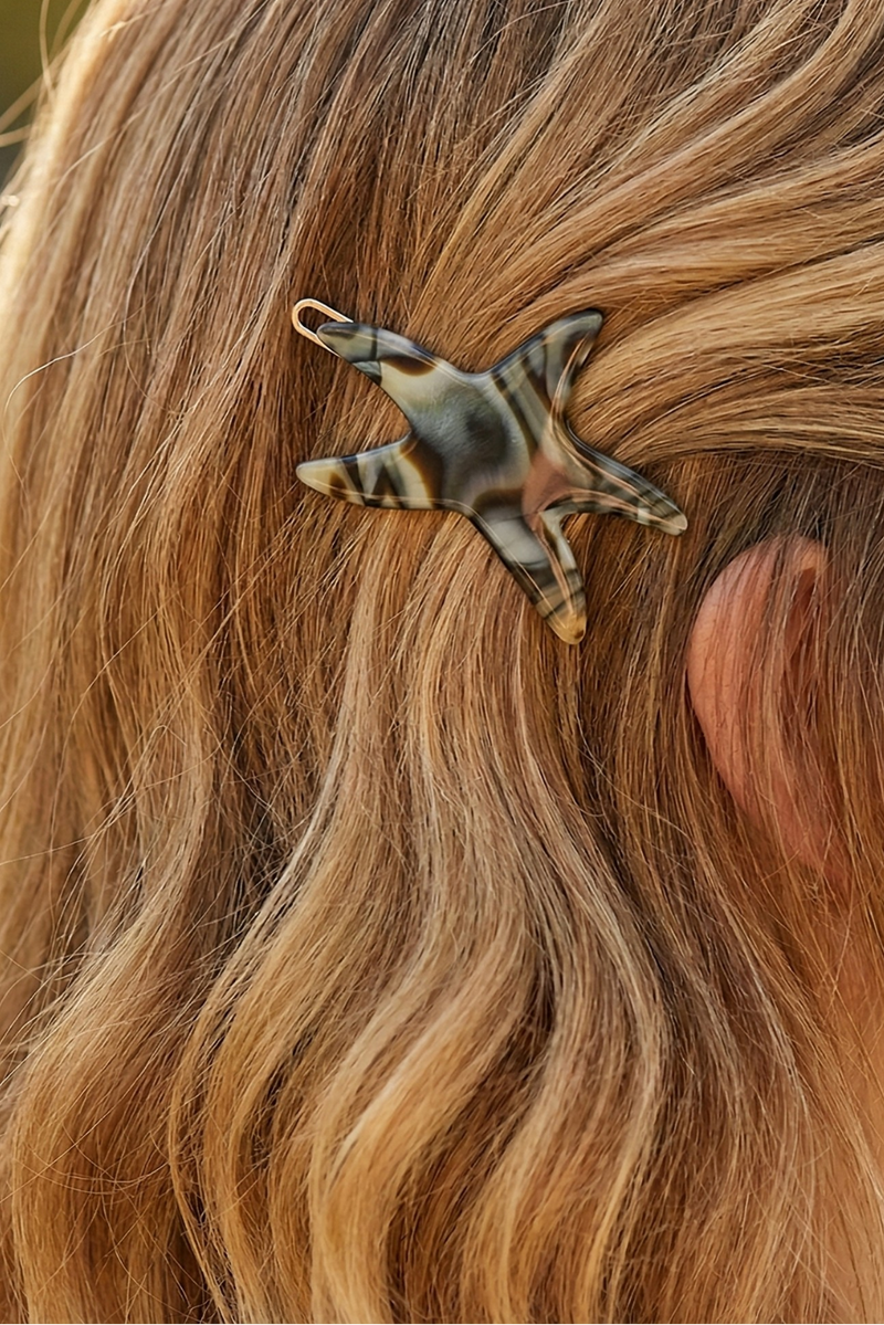 star fish barette on blonde hair
