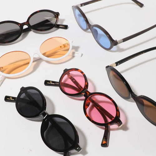Collection of various sunglasses on a white background