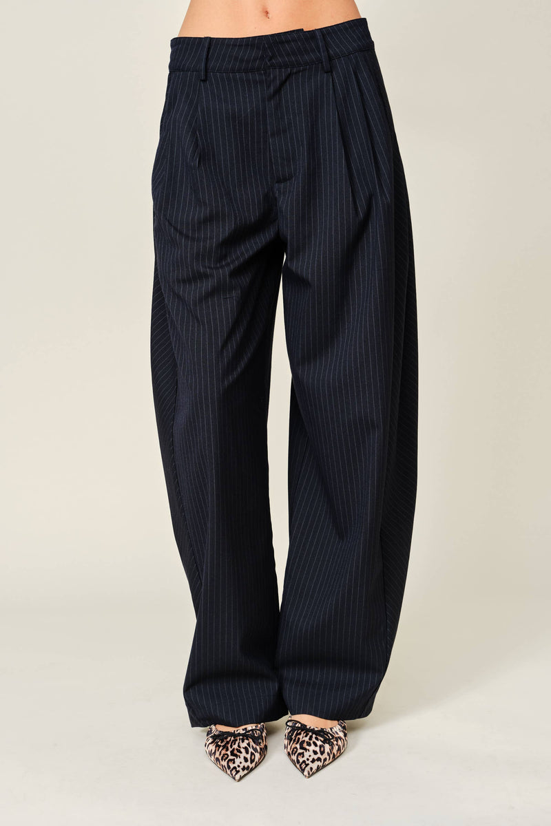 Black pinstripe pants on a white background