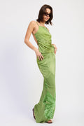 Woman wearing a green dress with lace details on a white background