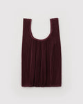 burgundy pleated bag on light grey background